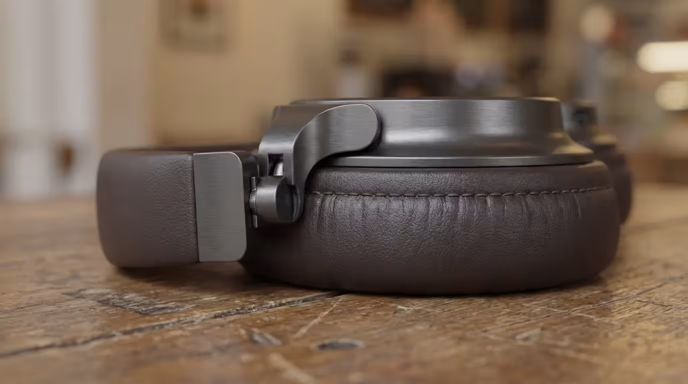 Macro photography of noise-canceling headphones on a wooden table representing portable focus.