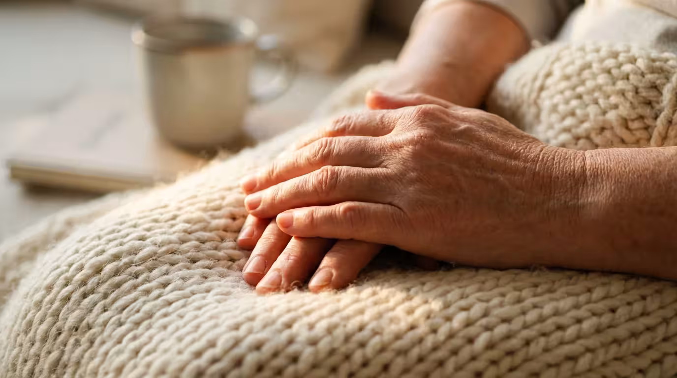 Macro photography of relaxed hands on textured fabric representing mindfulness and mental readiness.